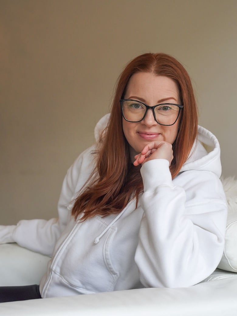 Stacey Lynn Mitchell seated, smiling at the camera
